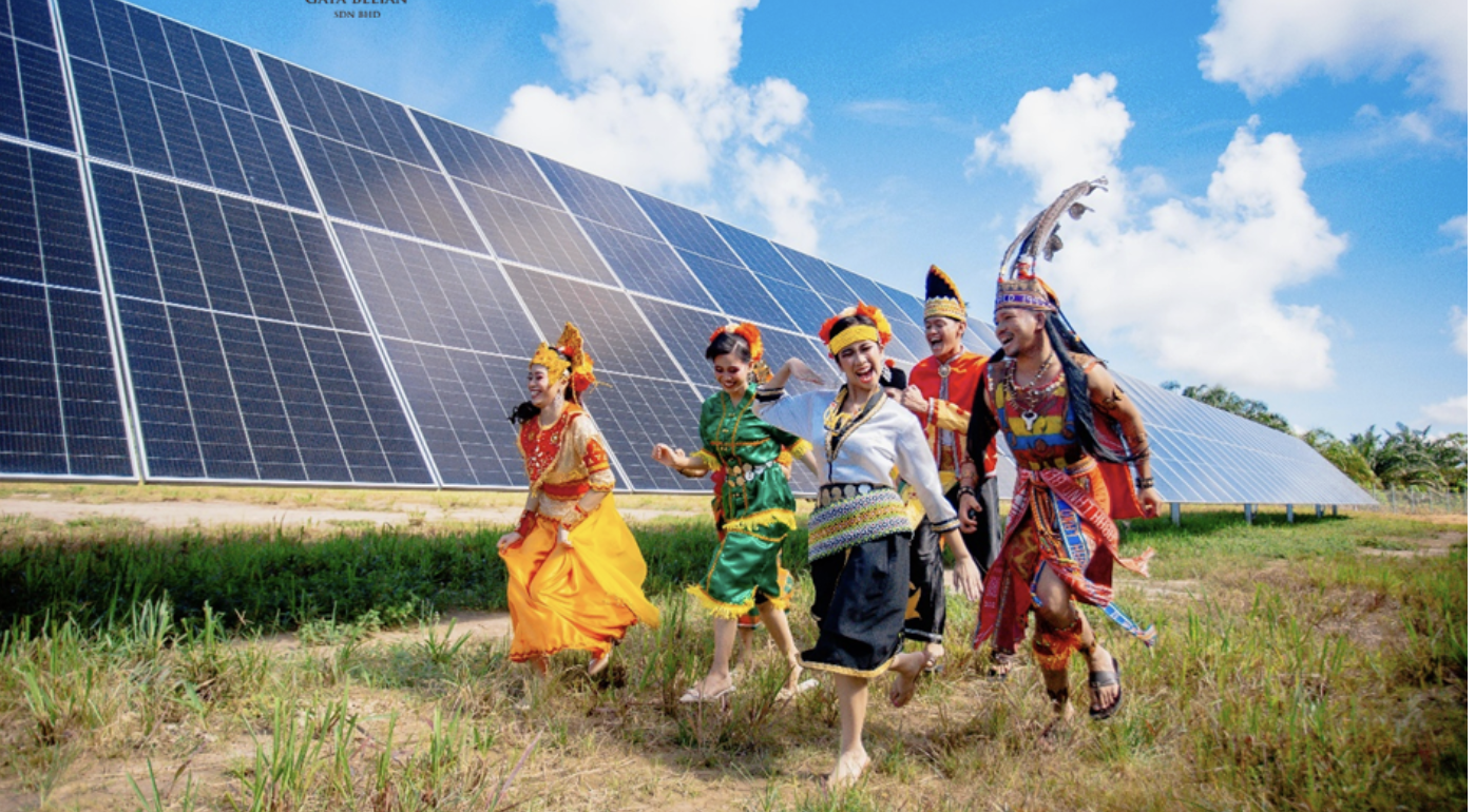 Sabah cultural performers with solar panels